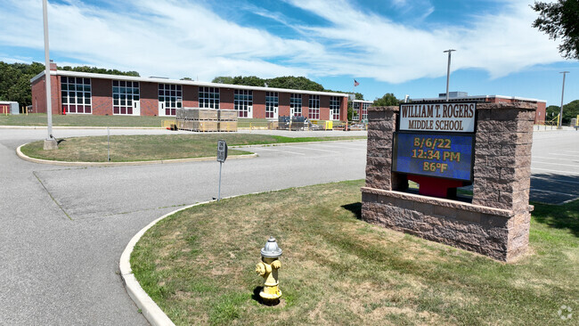 The entrance to William T. Rogers Middle School has a digital sign to greet you.