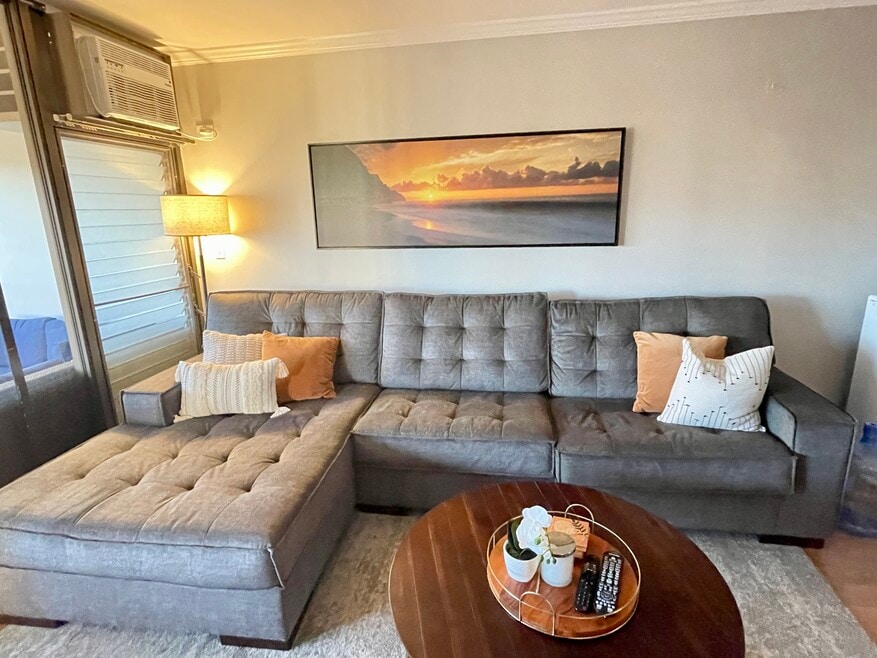 Furnished living room with chaise couch.