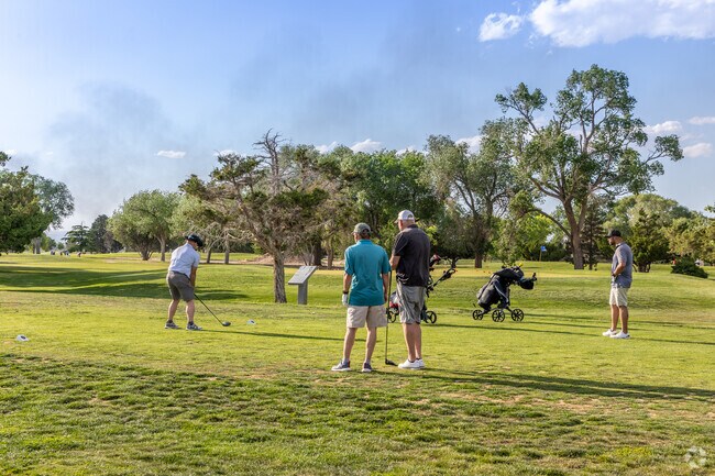 The Los Altos Golf Course layout features two large lakes, numerous mature trees, and large sand traps near the Highland Business neighborhood.