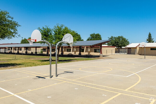 Pioneer Middle School provides basketball courts and covered break areas for students.