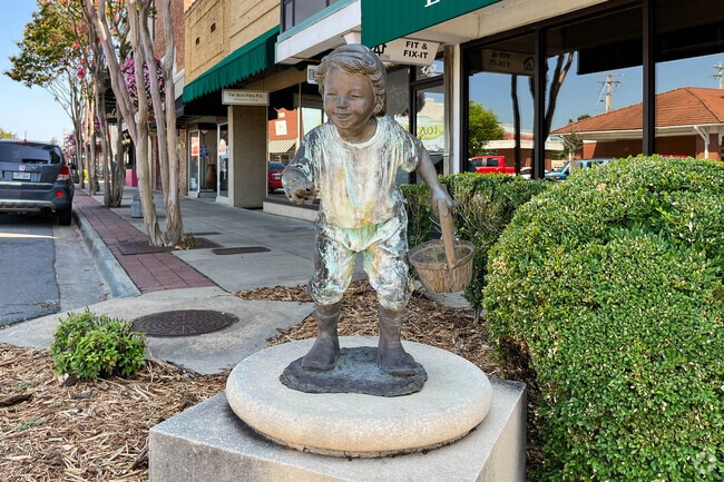 Cast bronze sculptures in Downtown Conway celebrate education and local folklore, adding artistic character to the streetscape.