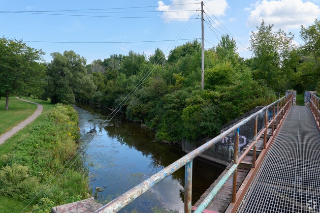 A bridge carries pedestrians over the creek at Salmon Creek Park in Hilton.