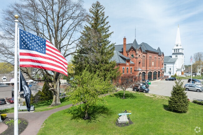 Parks, Town Hall, and churches line the bustling Franklin St in Holbrook.