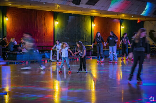 Friends laugh and have a good time at Roller King in Cresthaven Roseville.