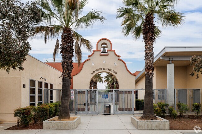 A bell hangs on the mission-style entrance of Frank Augustus Miller Middle School.