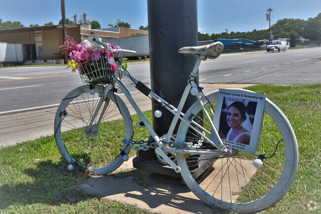 A memorial sits near one of the Swamp Rabbit Trail's entrances in Berea.