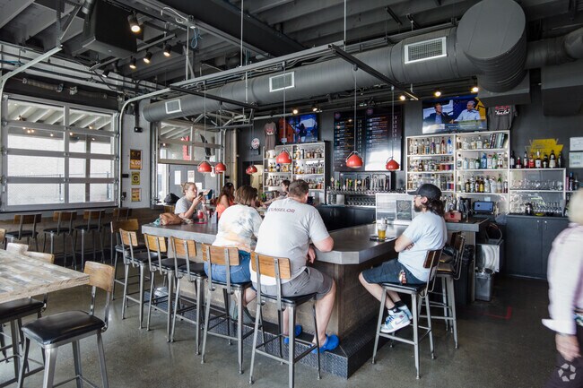Not hungry? Grab a drink at the bar in Rear End Gastropub & Garage.