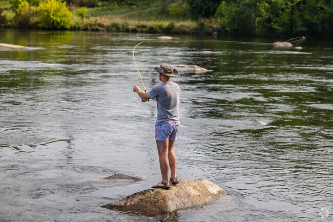 Fly fishing is a popular pastime along the Saluda Riverwalk in Saint Andrews.