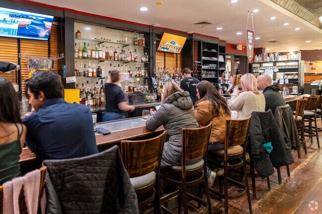 Sip on a freshly poured craft beer from Zingerman's Roadhouse, next to Liberty Glen.
