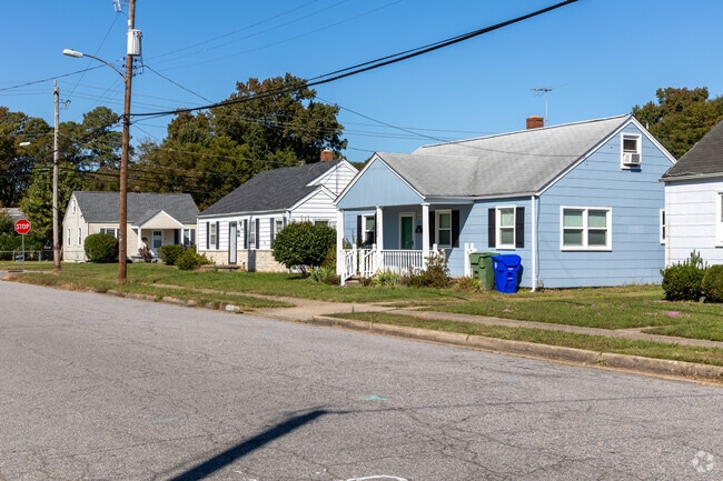 A set of Cape Cod homes on a street in Brandon Place.