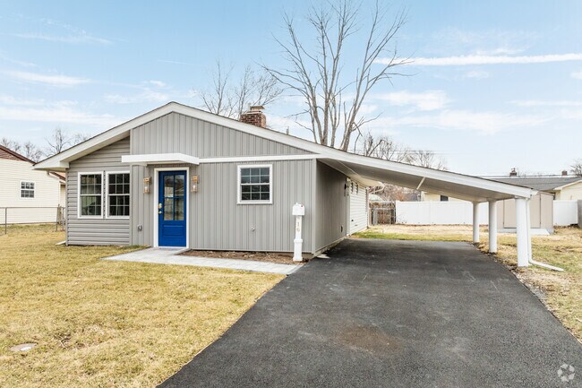 This newly-renovated ranch home along Burning Bush Lane in Birch Valley features new siding, front door, and a car port.