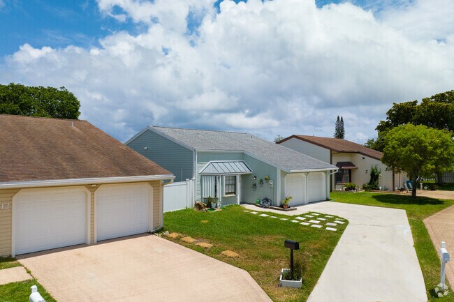 Multiple two-car garage family homes line the streets in High Ridge gated communities.