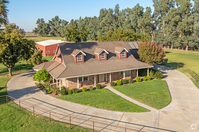 Farmhouses sit on productive agricultural land throughout the McSwain area.