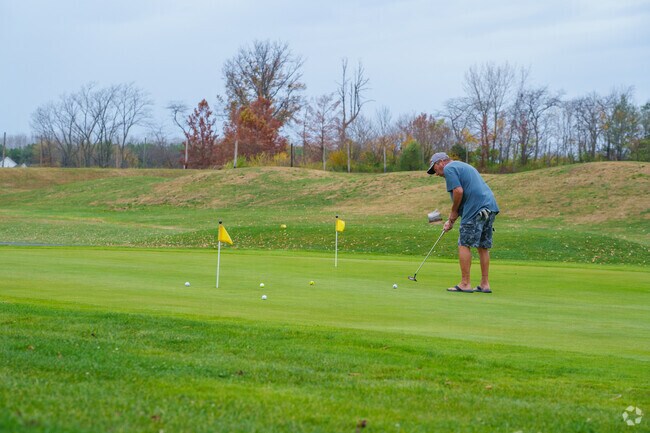 Work on your pitch and putt game at the Dakota Landing Golf Course practice green.