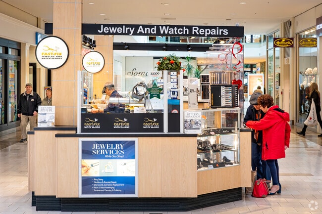 Shoppers look for jewelry at a kiosk at Hawthorne Mall, not far from Gregg's Landing.