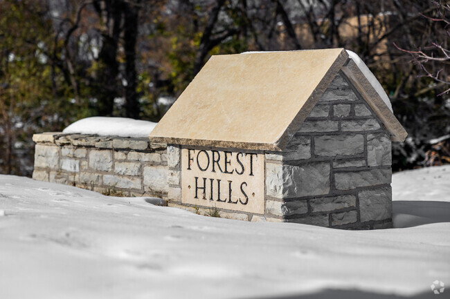 The entry for Forest Hills greets you with a small stone sign.
