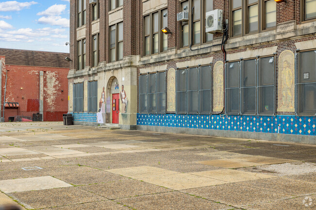 Universal Vare Charter School has a large paved area for students to play outside.