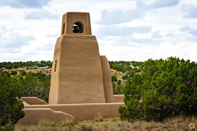 Hilly terrain is marked by Southwest-style bell towers in Las Campanas.
