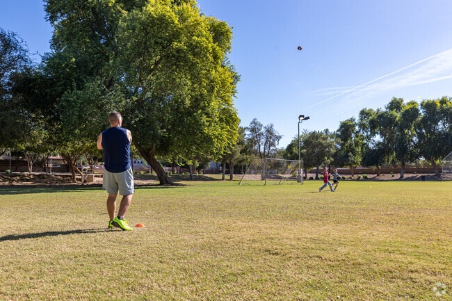 Cortina Park features sports courts and a shaded playground.