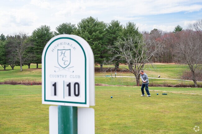 Locals take their first swing of the season at Hopedale Country Club.