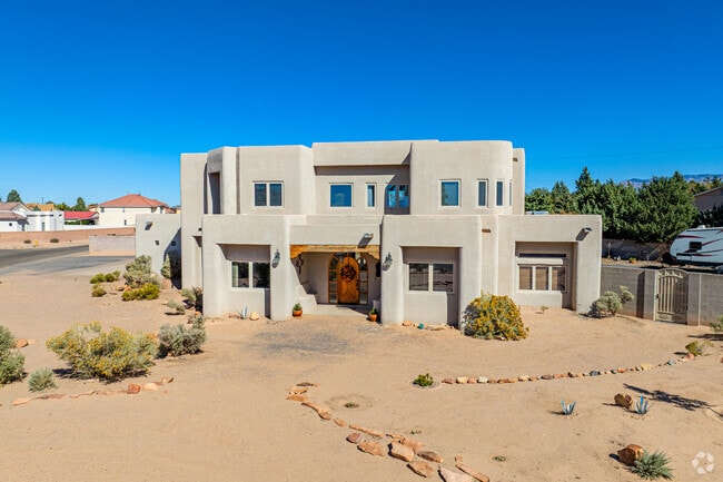 There are several stucco homes with southwest architectural influence in Taylor Ranch.
