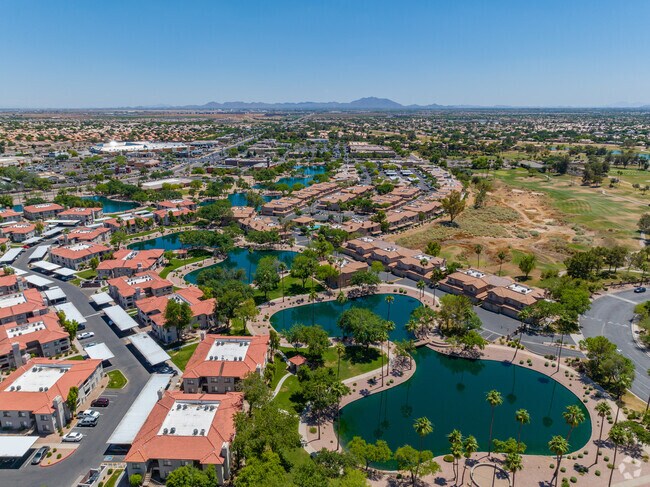 Upscale condos and apartments sit beside the man-made lakes of Superstition Springs.