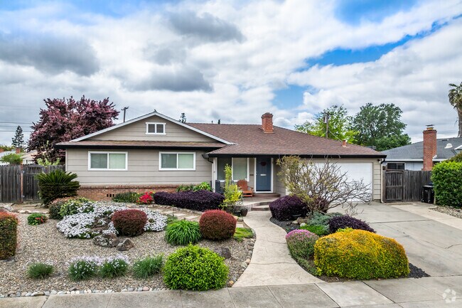 This ranch-style home has a beautiful, landscaped yard in Cordova Gardens.