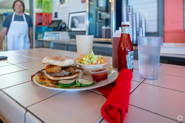 Stop in for a burger at Crazy Burger, a divey eatery who grabbed the attention of Guy Fieri.