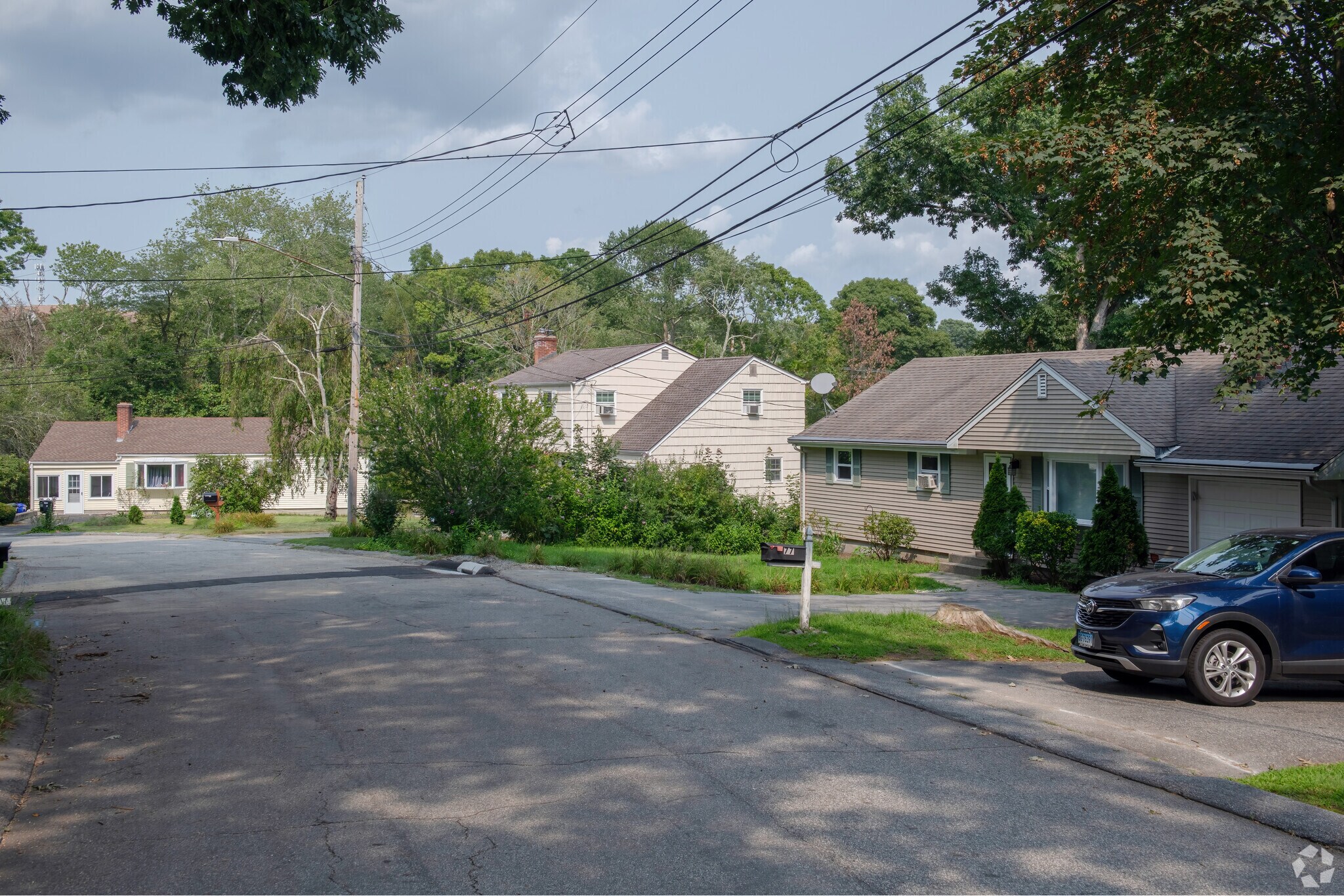Shady streets are tucked behind the shops of Route 1 in Long Hill neighborhood.
