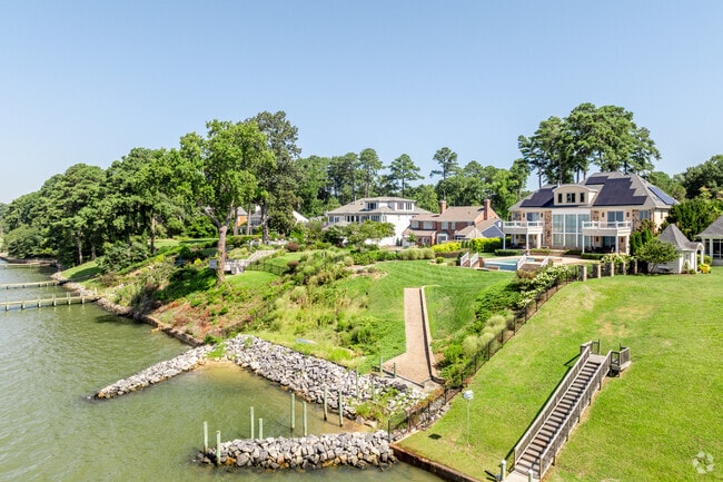 Large waterfront estates with large backyards and private docks line the streets in Riverside.