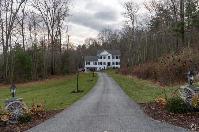 Tour a colonial with ample yard space.