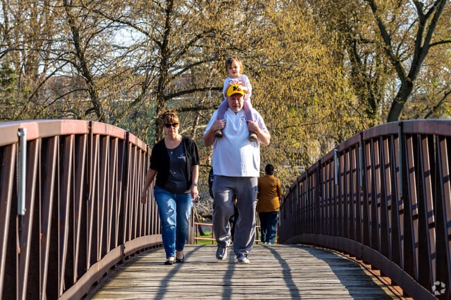 Access Island Park using one of three bridges that span to various neighborhoods around Elkhart.