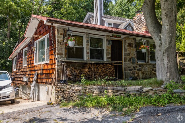 Cozy living in Cabin John's picturesque cottage houses, surrounded by nature's beauty.