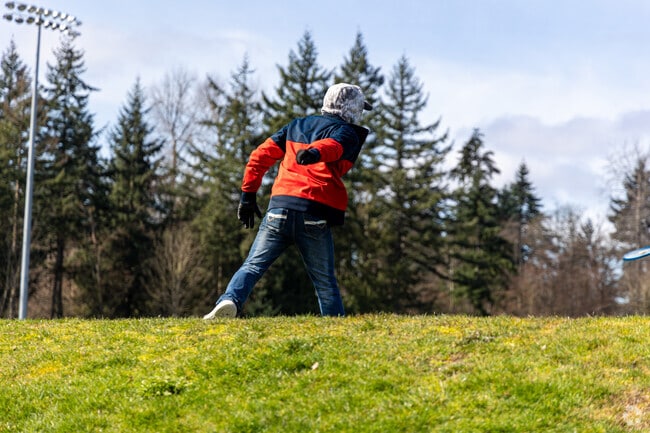 Lakota Park can be enjoyed in many ways, such as playing Frisbee.