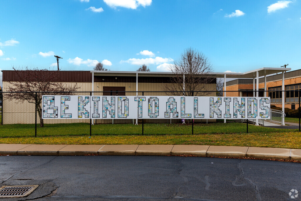 Teachers greet students at Main Elementary School with warm smiles each day.