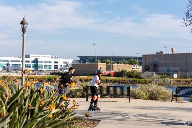 Friends rollerskate at the the Liberty Station Esplanade near Loma Portal.