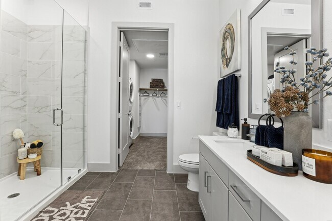 Spa-inspired bathrooms with modern finishes.