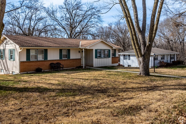 A large family home offers spacious front and back yards in Muncie.