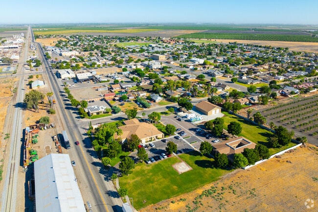 San Joaquin offers quiet streets and affordable homes with palm-lined lawns.