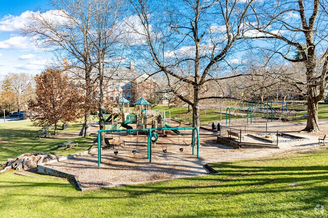 The Warren Park is a beautiful park in Wellesley with playground, structures, and benches.