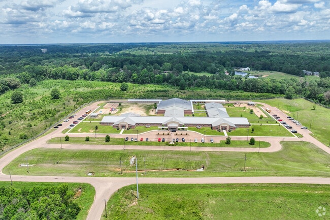 Magee Elementary School enrolls 556 students in grades K through 5 yearly.