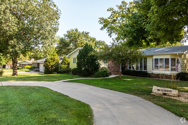 Some ranch-style homes have small circle driveways in Blue Hills.