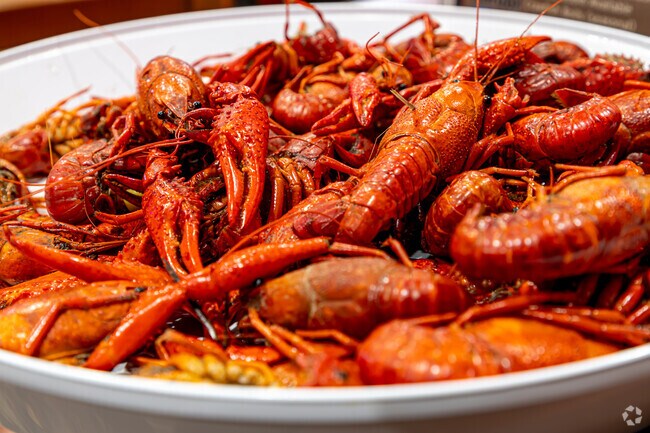 The Harbor Bar & Grill in Whitney-Cecile serves hot boiled crawfish, a beloved Louisiana delicacy enjoyed by locals and visitors alike.