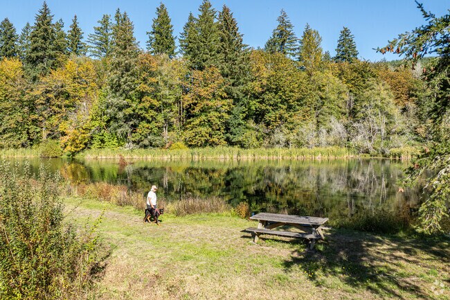 The surrounding woods and Ryderwood Pond create a serene atmosphere to contemplate nature.