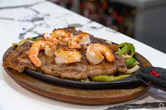 T-Bone topped with grilled shrimp is a popular dish at La Barra Bar and Grill in Ingleside.