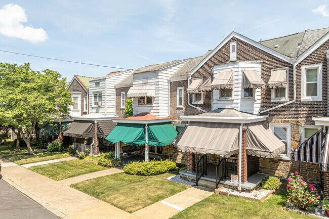Awnings on this Bayard Square homes provide free cooling from the summer sun.
