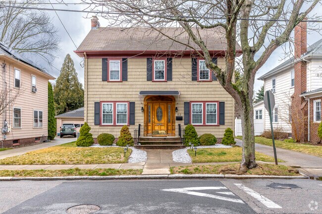 This wood sided colonial home stands out in Mount Pleasant, Providence.