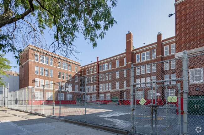 The fenced in schoolyard at PS 10 in Brooklyn creates a safe play space for the students.