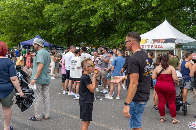 Crowds gather at the New Jersey Pizza Festival to enjoy local pies and live entertainment.