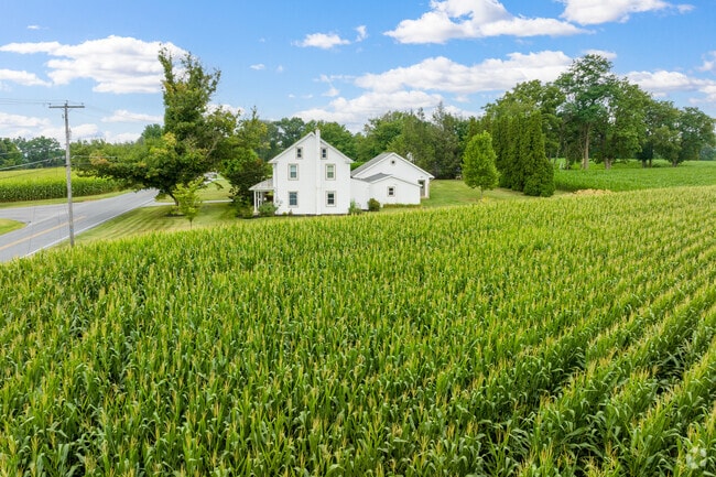 Crops grow around this historical old home in Clay.